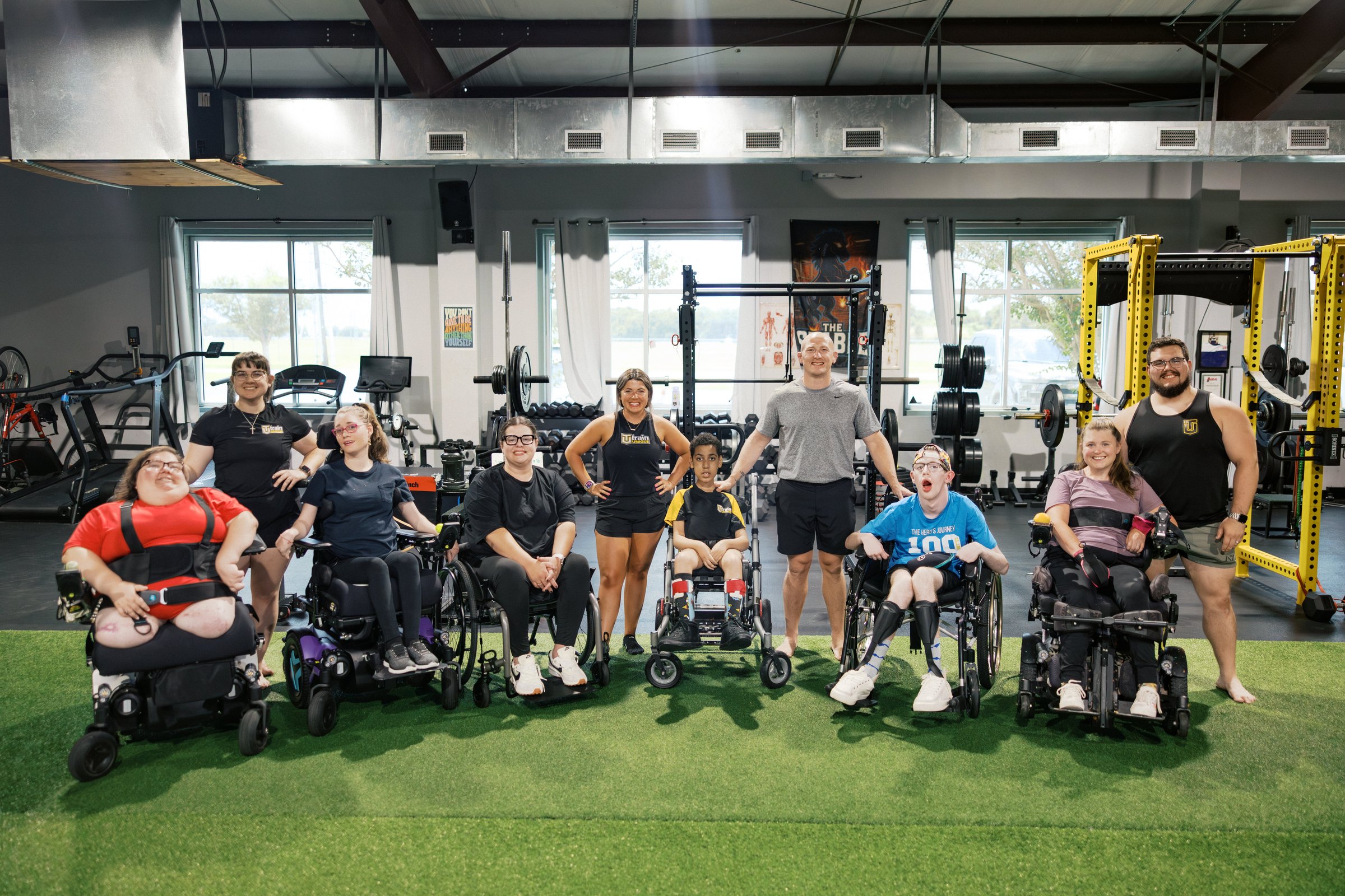 Athletes and coaches together on the gym floor